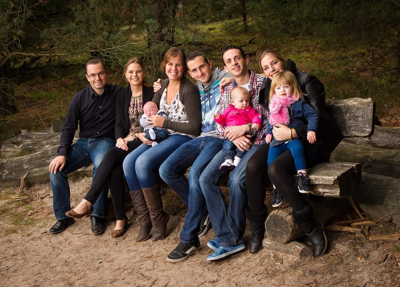 A classic family portrait, taken in a studio setting. The family is dressed in coordinated outfits and posed in a traditional arrangement. The lighting is soft and flattering, highlighting their smiles and expressions. The composition is formal and balanced, emphasizing the unity and connection of the family. The image represents the timeless appeal of family portraits. 8k resolution, hyperrealistic.